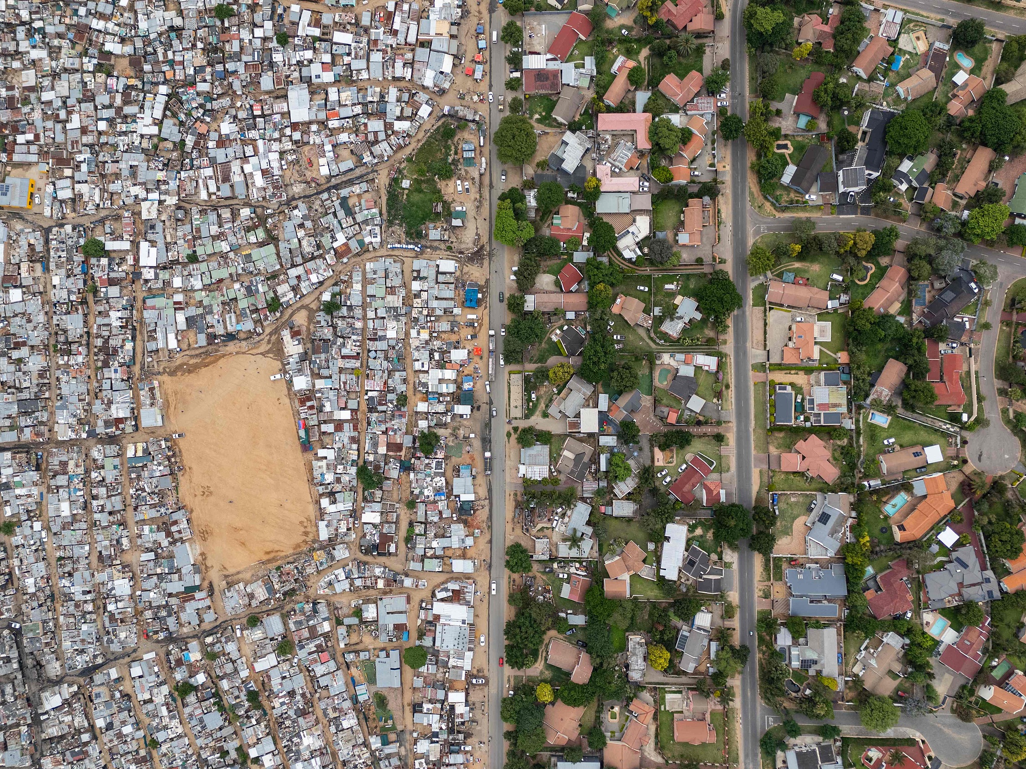 This aerial view shows Kya Sands (L) and Bloubosrand (R) in Johannesburg, November 14, 2025. / VCG