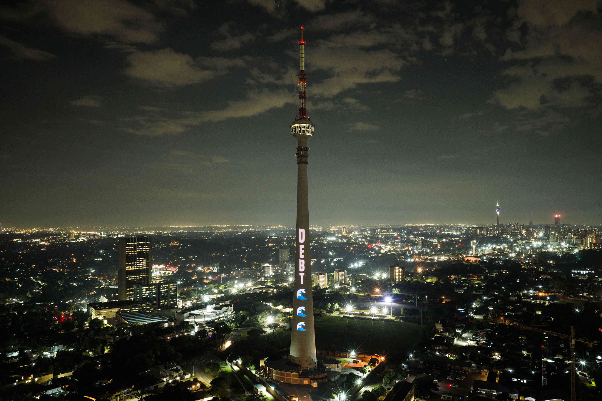 Activists lit up Johannesburg's skyline with towering nighttime building projections ahead of the historic 2025 G20 Summit, urging world leaders to deliver bold debt reform and climate financing in Johannesburg, South Africa, November 19, 2025. /VCG