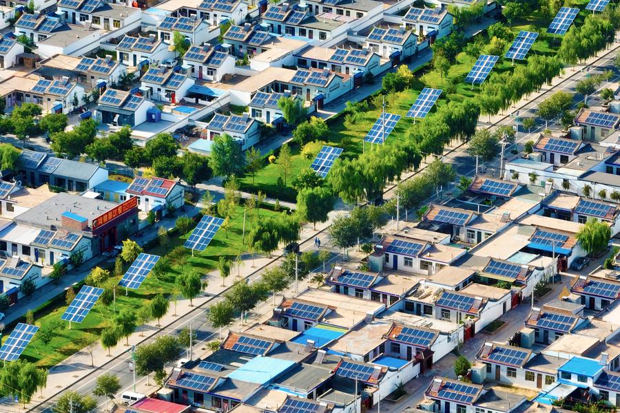 A solar photovoltaic system on the rooftops of buildings in Yuanlong Village of Minning Town, Yongning County in Yinchuan, capital of northwest China's Ningxia Hui Autonomous Region, August 23, 2024. /Xinhua