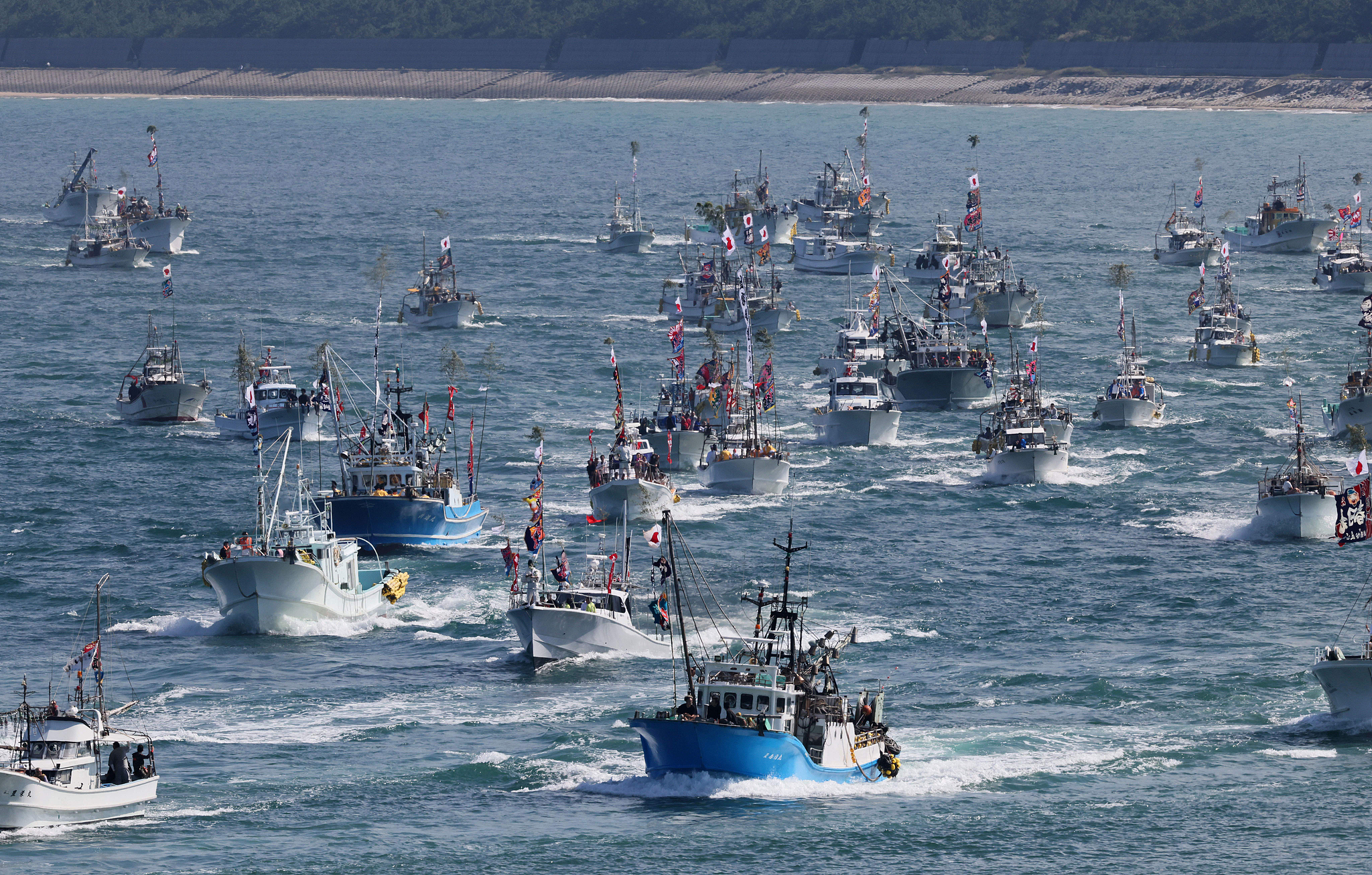 Fishing boats take part in a voyage to pray for a bountiful fishing harvest, Fukuoka Prefecture, Japan, October 1, 2025. /VCG