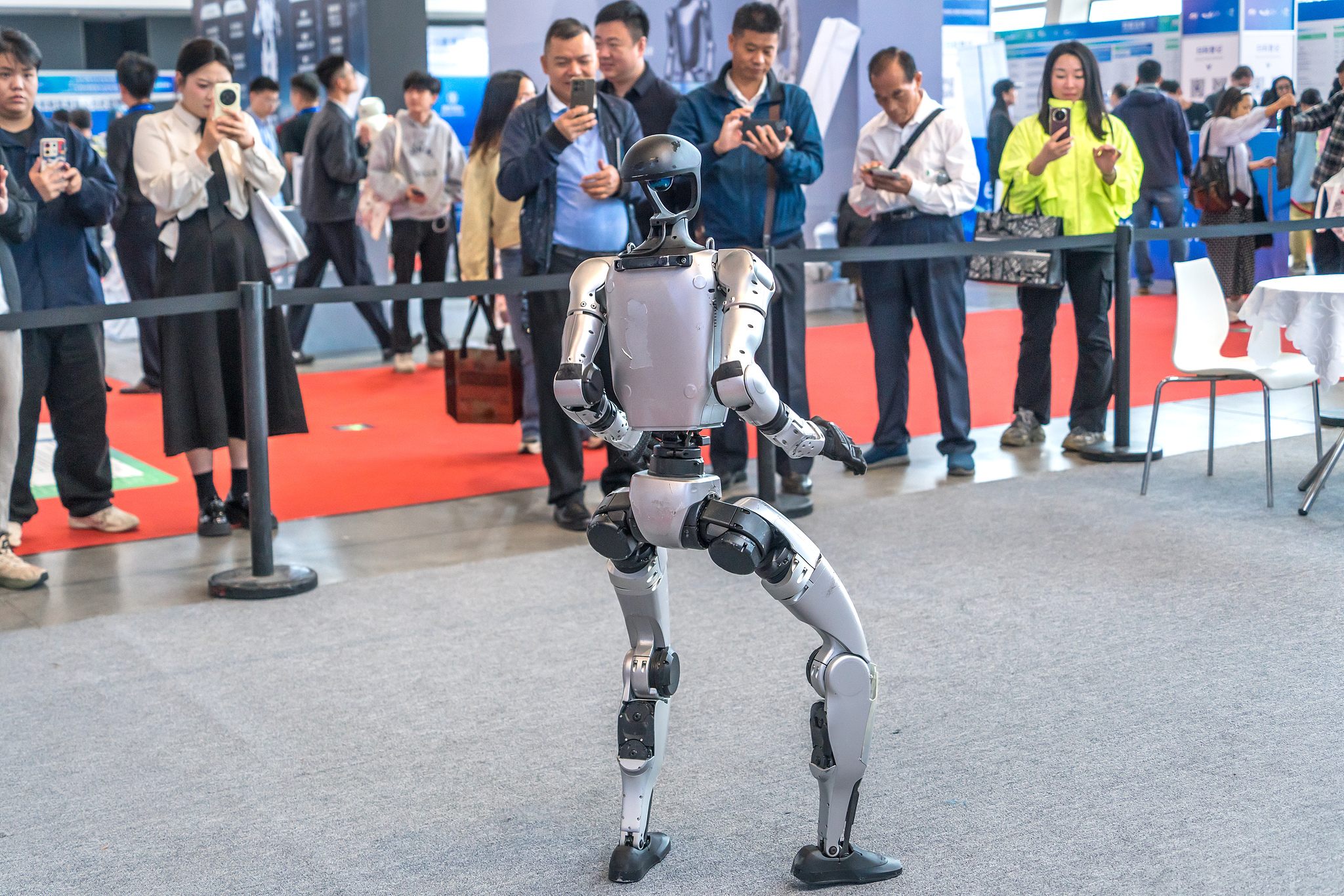 Unitree Technology showcased a dance performance of its Unitree G1 humanoid robot, October 22, 2025, in Guangzhou, China's Guangdong Province. /VCG