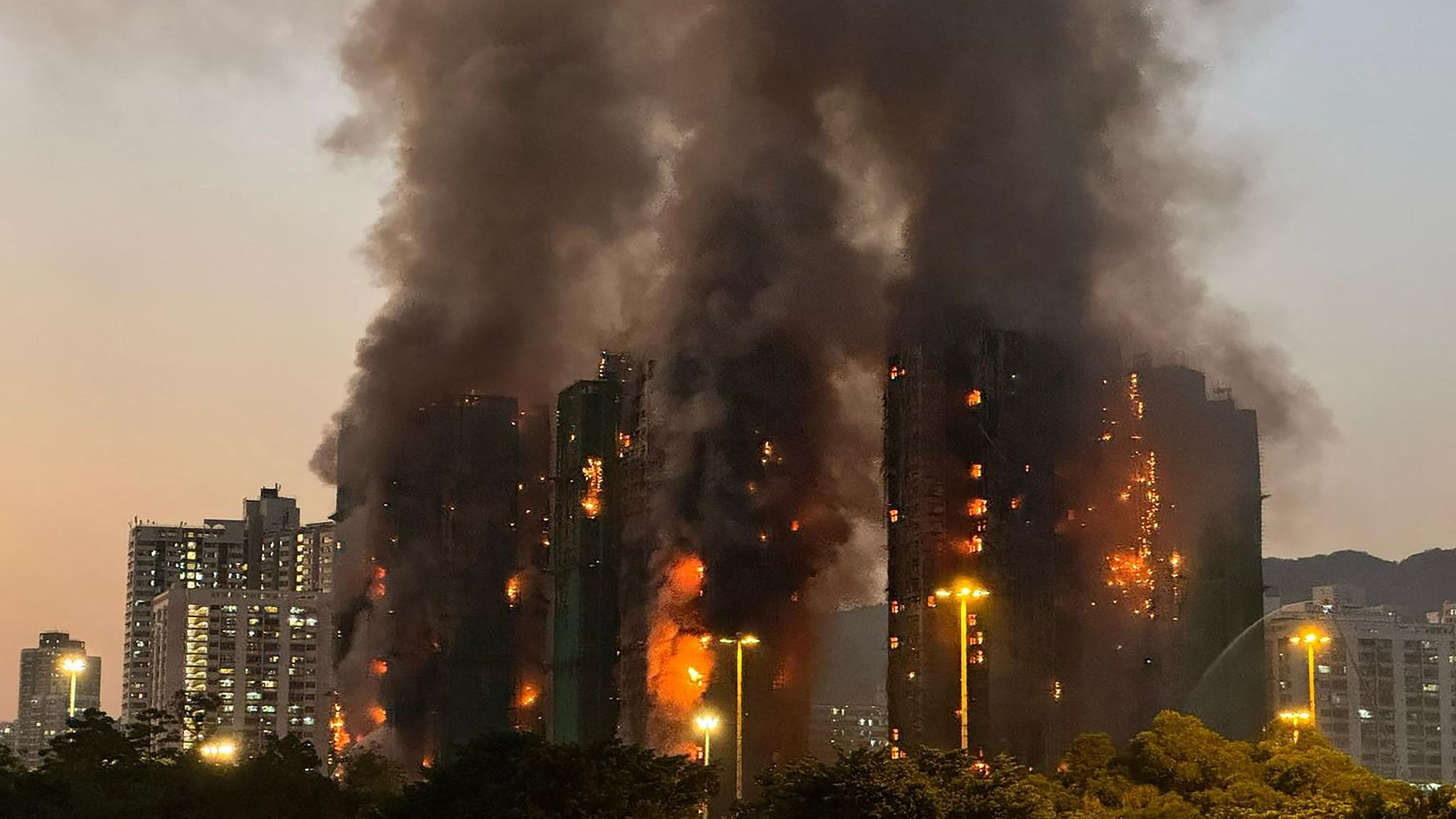Fire alarm upgraded to highest level as 13 die in Hong Kong blaze
