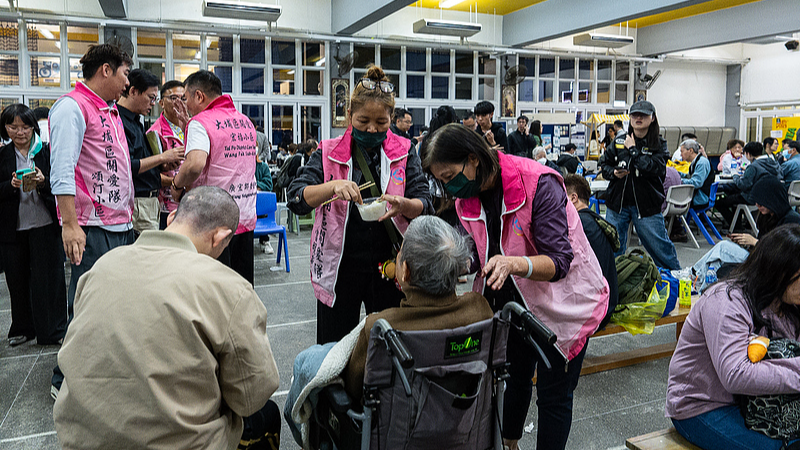 Residents rest at a temporary shelter after a fire broke out at Wang Fuk Court, a residential estate in the Tai Po district of New Territories, the Hong Kong Special Administrative Region, south China, November 26, 2025. /VCG
