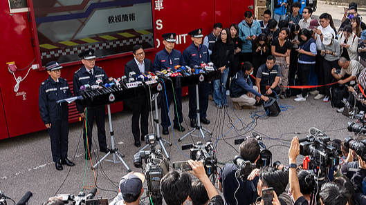 Hong Kong Secretary for Security Chris Tang Ping-keung (center) speaks to the media after deadly fires at Wang Fuk Court, a residential estate in the Tai Po district of Hong Kong Special Administrative Region's New Territories, November 28, 2025. /VCG