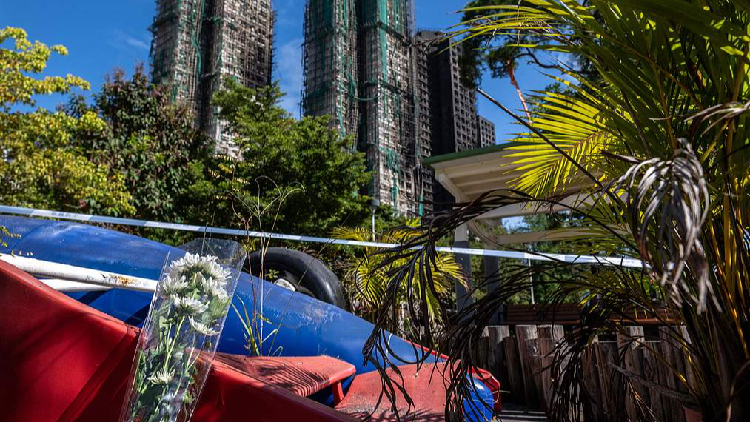 China's top financial regulator vows strong backing for HK fire relief