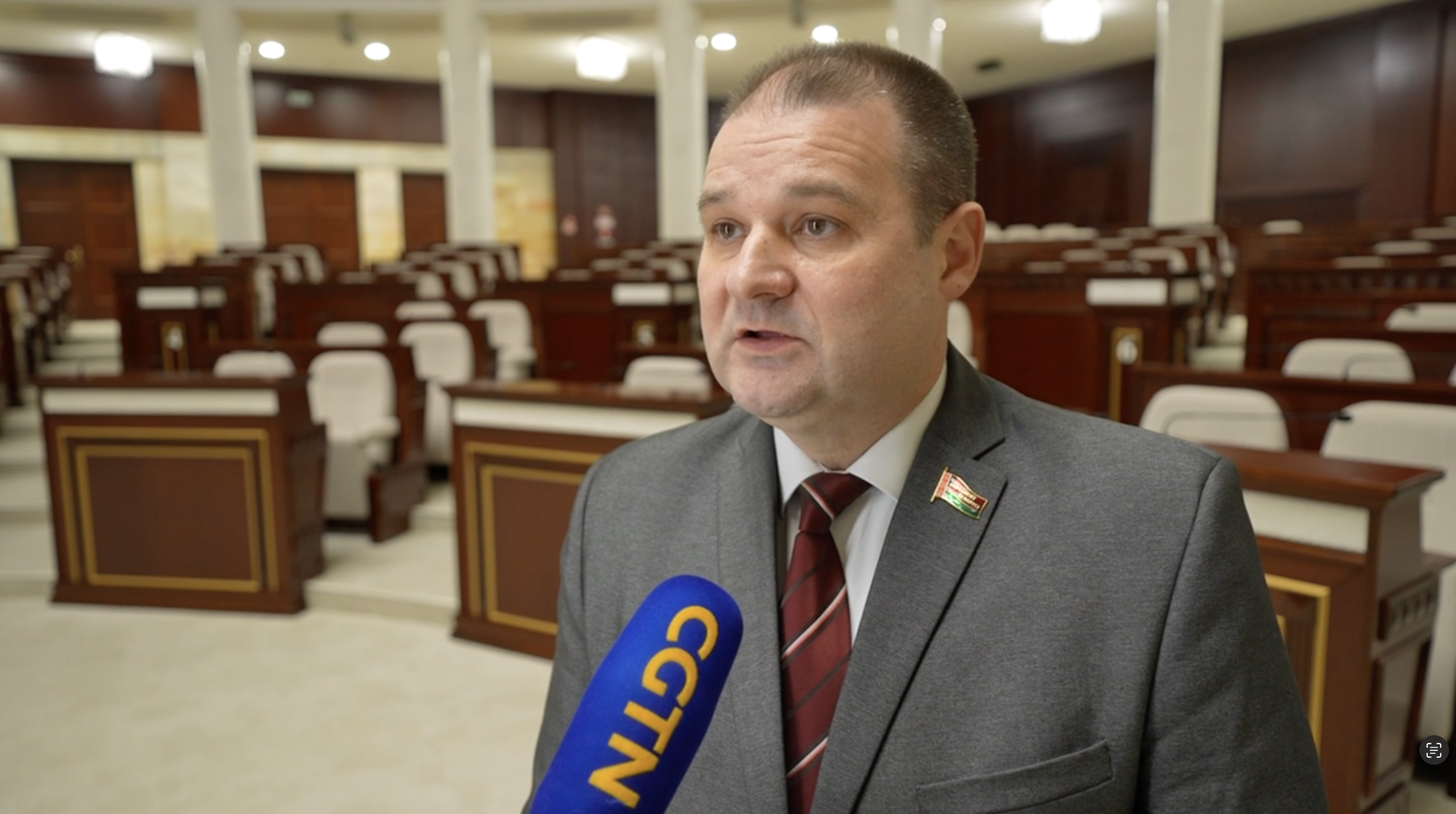 Nikolai Buzin, chairman of the Standing Commission on Human Rights, National Relations and Mass Media of the House of Representatives of the National Assembly of Belarus, speaks to reporter during an interview. /CMG