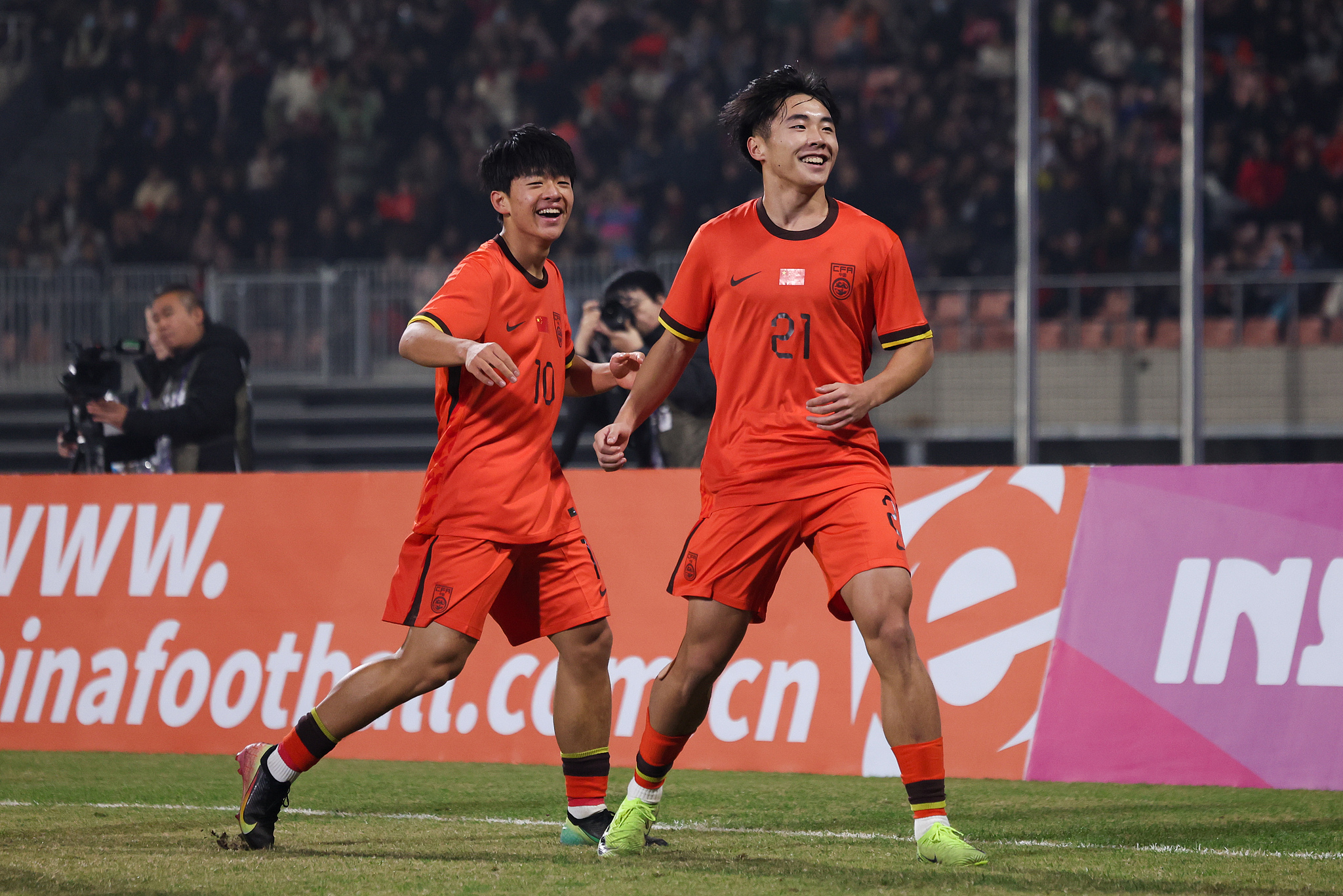 China's Shuai Weihao (#21) celebrates after scoring a goal against Bangladesh in an AFC (Asian Football Confederation) Under-17 Asian Cup qualifier in Group A in southwest China's Chongqing Municipality, November 30, 2025. /VCG