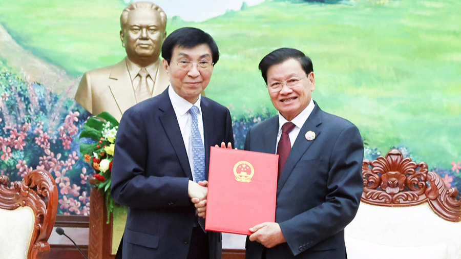 Wang Huning, a member of the Standing Committee of the Political Bureau of the Communist Party of China Central Committee and chairman of the National Committee of the Chinese People's Political Consultative Conference, meets with Thongloun Sisoulith, general secretary of the Lao People's Revolutionary Party Central Committee and Lao president, in Vientiane, Laos, December 1, 2025. /Xinhua