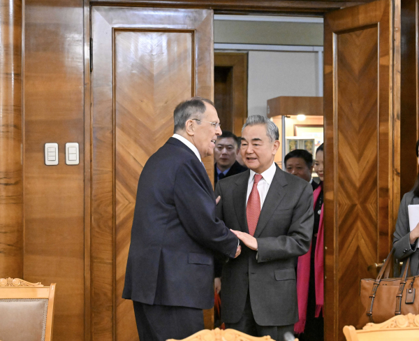 Chinese Foreign Minister Wang Yi shakes hands with Russian Foreign Minister Sergei Lavrov in Moscow, Russia, December 2, 2025. /VCG