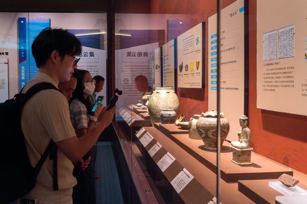 Visitors see the earthenware displayed at the 