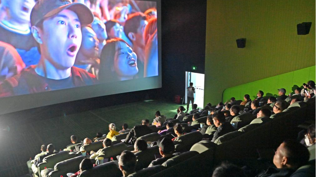 Visually-impaired people, together with their family members and volunteers, enjoy a movie at a cinema in Nanning, south China's Guangxi Zhuang Autonomous Region, December 3, 2025. /Xinhua