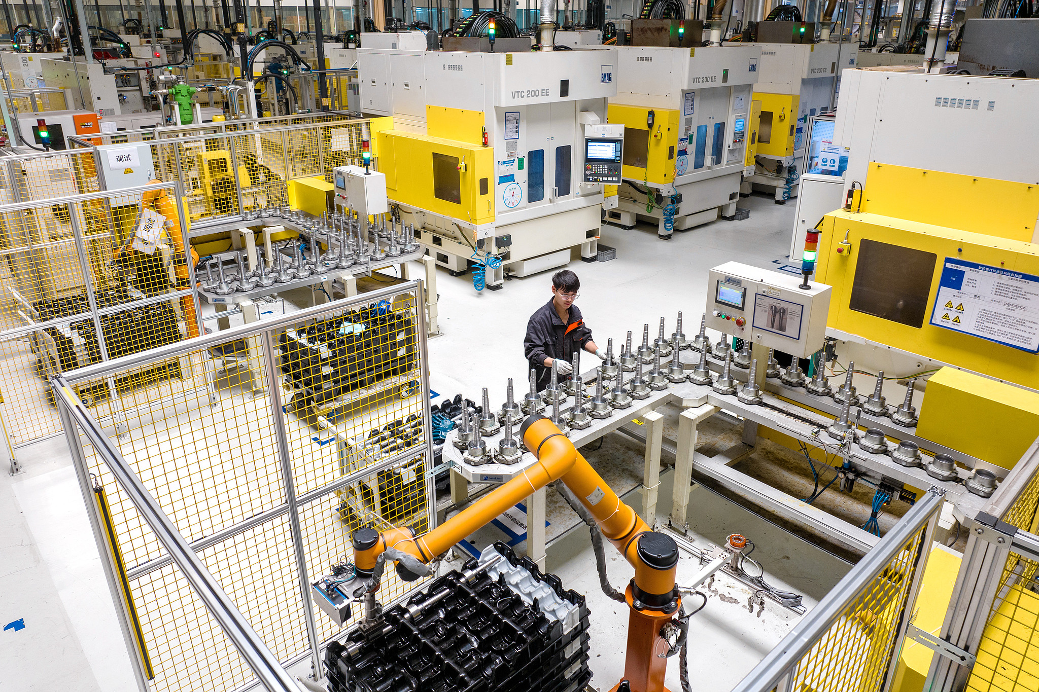 A technician working on an automated assembly line to produce 7DCT EVO dual-clutch automatic transmission in Changxing, China's Zhejiang Province, Dec. 4, 2025. /VCG
