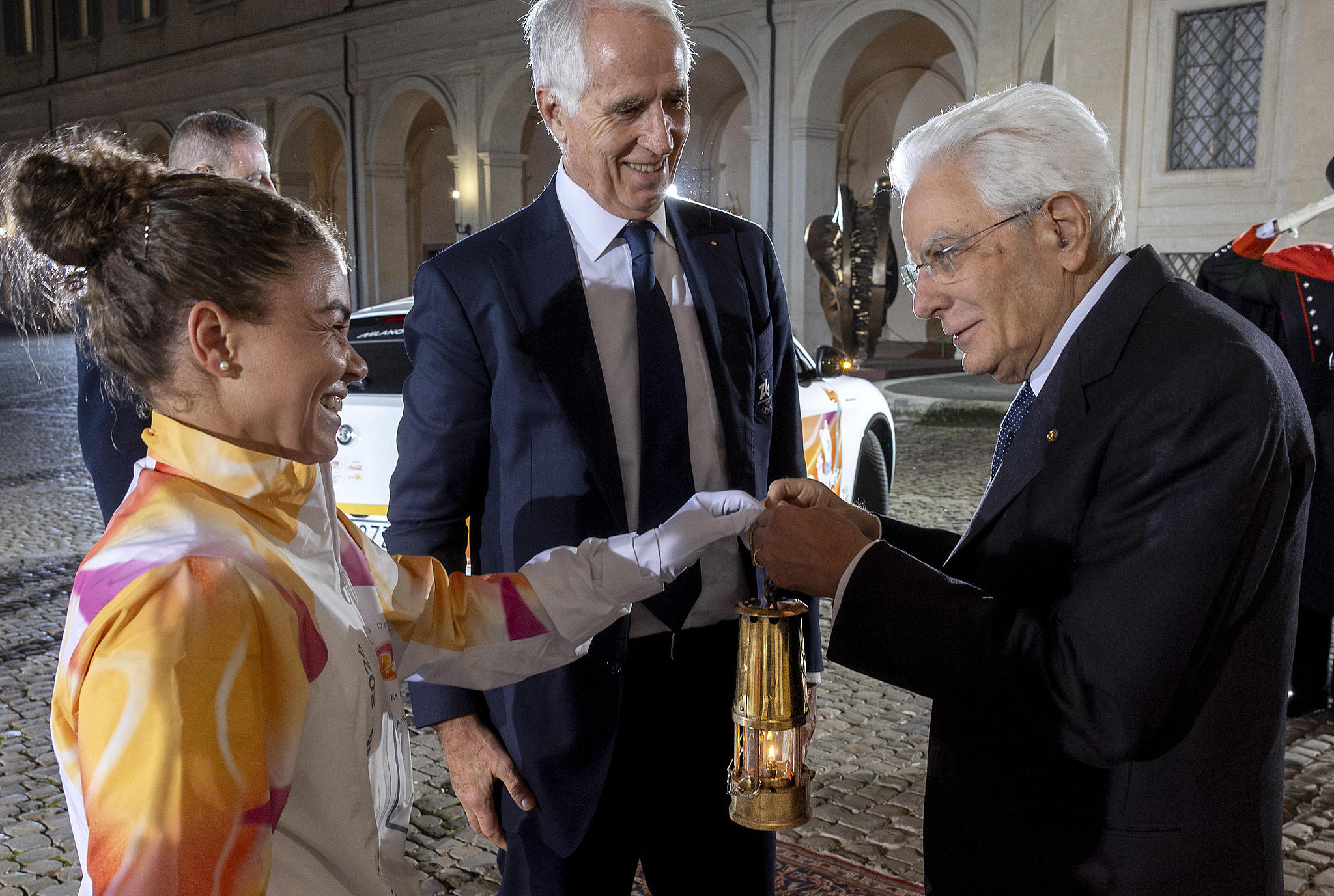 Italian President Sergio Mattarella (R) rreceives the flame for the 2026 Milano Cortina Winter Olympics from Italian tennis star Jasmine Paolini (L) during a handover ceremony at the Quirinale Palace in Rome, Italy, December 4, 2025. /VCG
