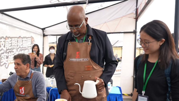 Josaia Gonewai (second from left) takes part in a hands-on coffee-making session.