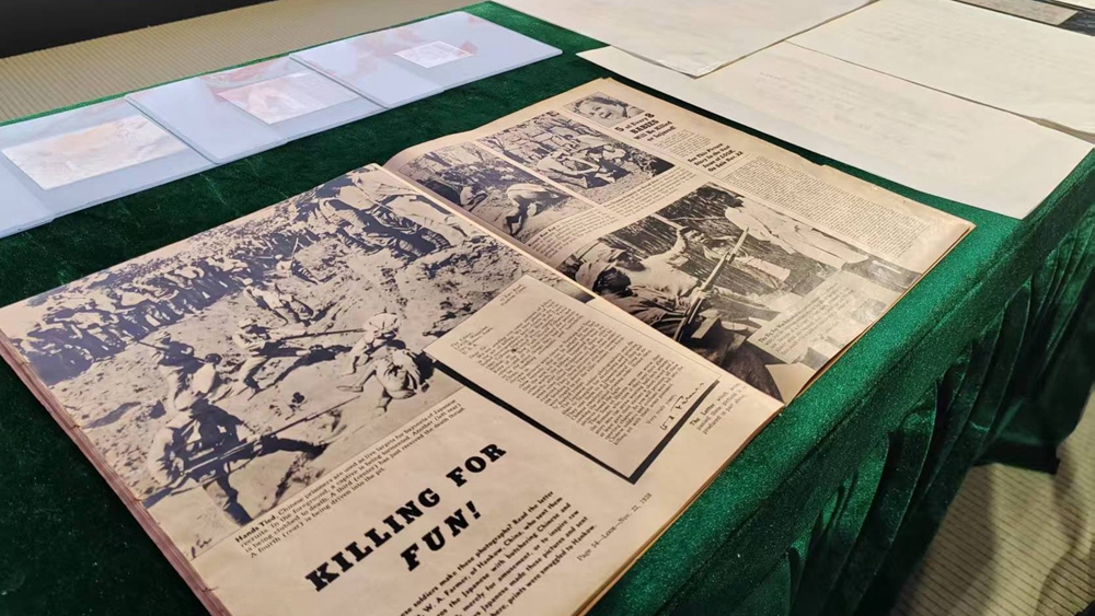 The English-language publication at the donation ceremony in the Memorial Hall of the Victims in Nanjing Massacre by Japanese Invaders in Nanjing city, east China's Jiangsu Province, December 5, 2025. /CMG
