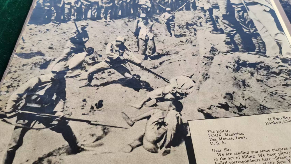 The English-language publication at the donation ceremony in the Memorial Hall of the Victims in Nanjing Massacre by Japanese Invaders in Nanjing city, east China's Jiangsu Province, December 5, 2025. /CMG