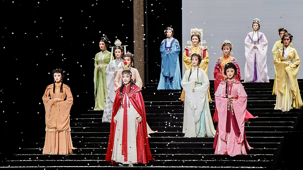 Dramatic elements, like headdresses and water sleeves, bring movement and flair to stage performances. /VCG