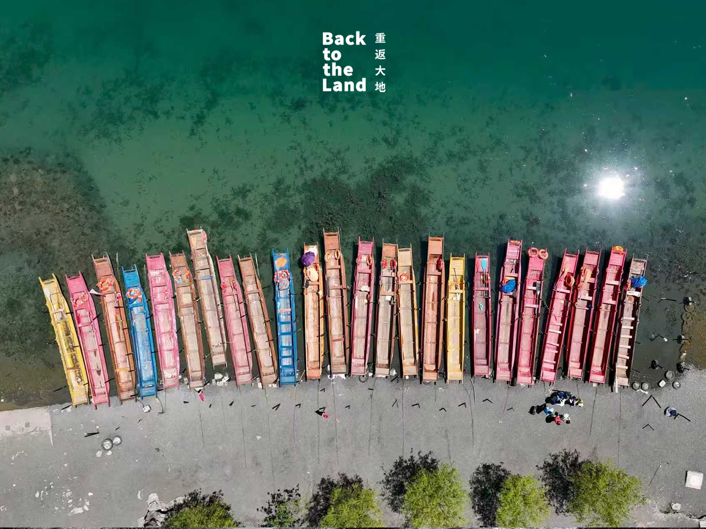 Wooden canoes are docked on Lugu Lake. /CGTN