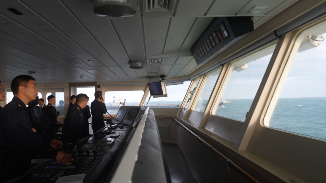 Haixun 06 crew members closely watch the drills in the Taiwan Shoal, Taiwan, China, December 6, 2025. /CGTN