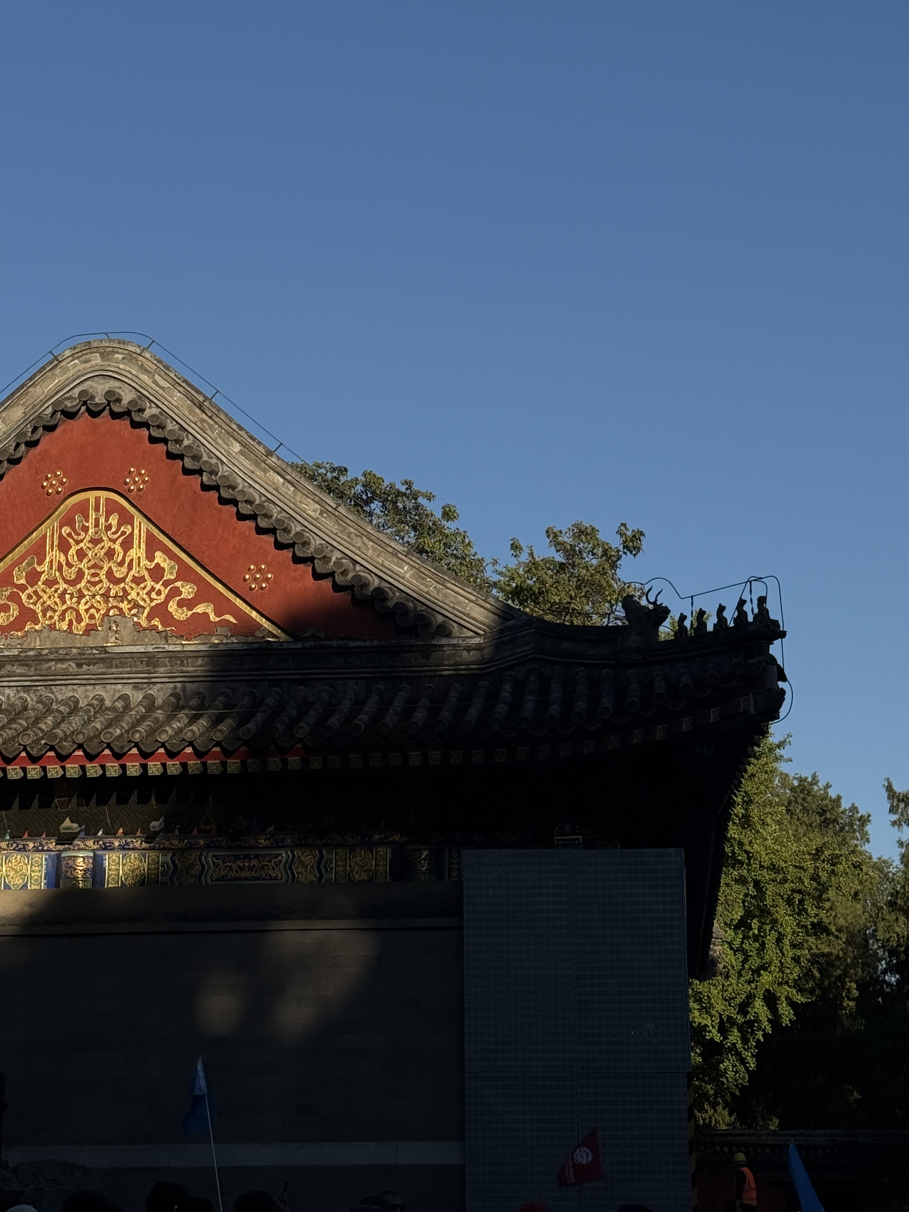 Sunlight reflecting on the reds and greens of a pavilion at the Summer Palace, Beijing, China, October 2025. Zaruhi Poghosyan/CGTN