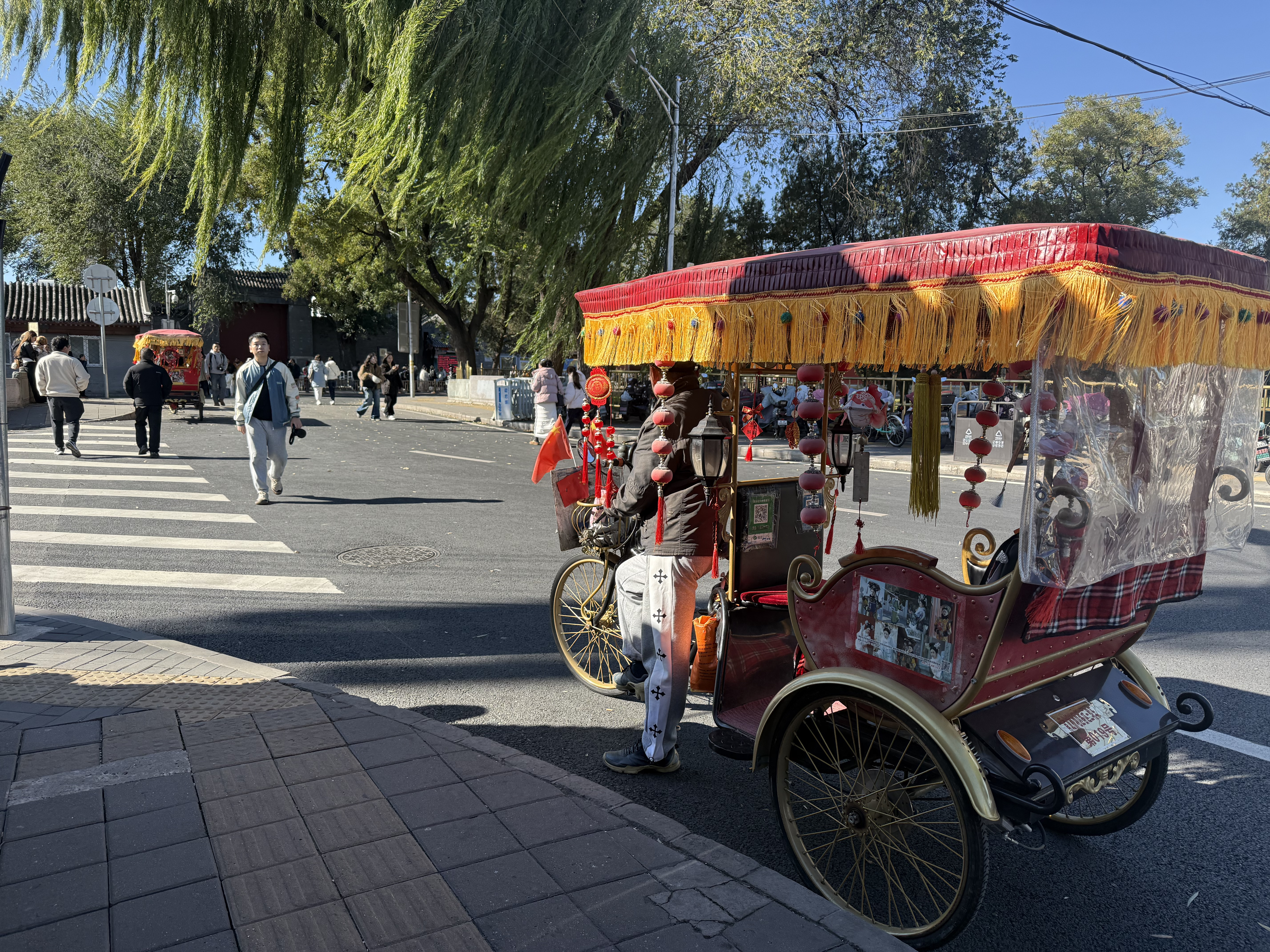 Traditional rickshaws are used for tours near the Summer Palace in Beijing, China, October 2025. Zaruhi Poghosyan/CGTN