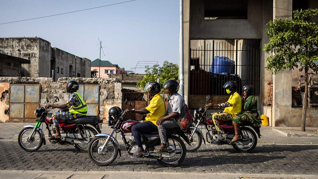 Motorbike taxis drive through Cotonou after Benin's president reassures the public that the army is regaining control after a failed coup attempt, December 7, 2025. /VCG