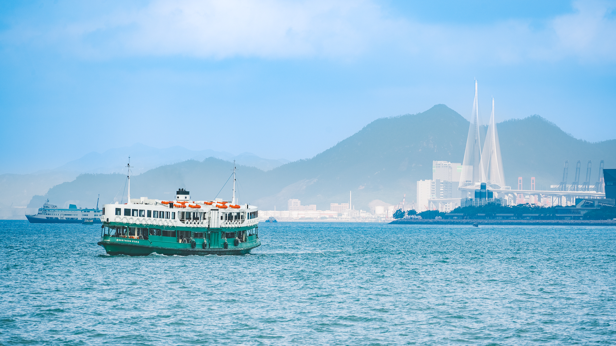 The Star Ferry is seen shuttling between two sides of the port in Victoria Bay, Hong Kong SAR, China, November 7, 2025. /VCG