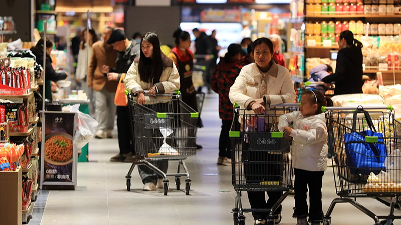 People shop at a supermarket in Huai'an City, east China's Jiangsu Province, December 6, 2025. /VCG