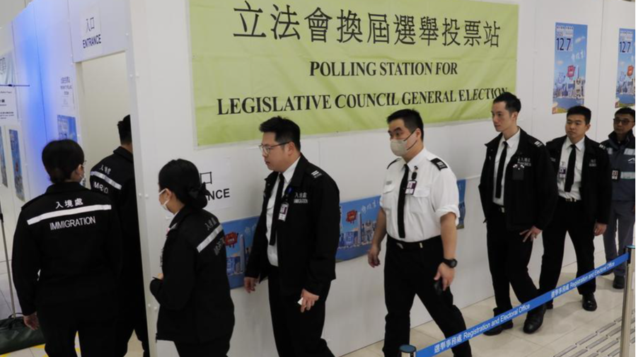 Voters arrive at a polling station at Hong Kong International Airport in Hong Kong, south China, December 7, 2025. /Xinhua