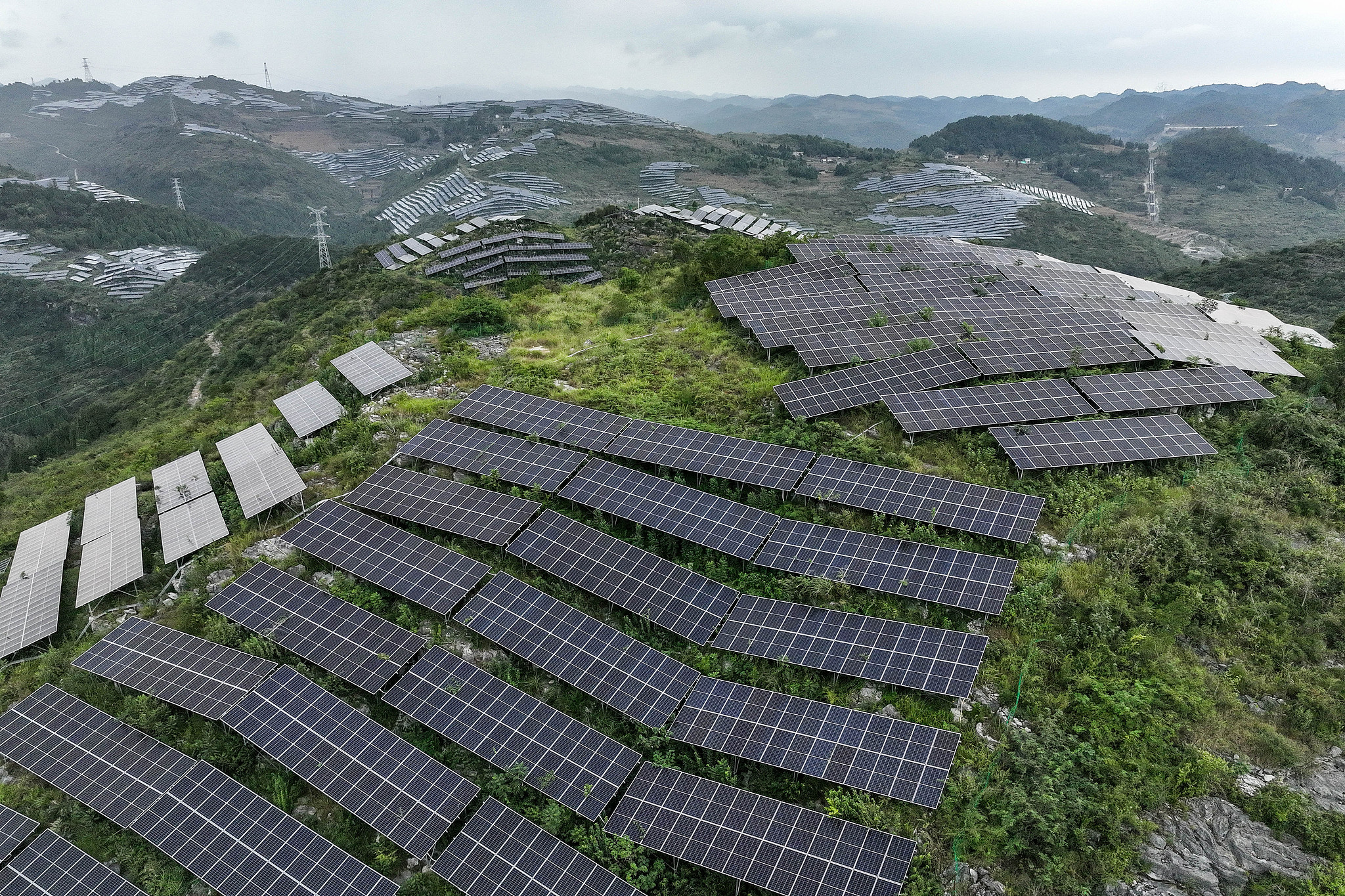 An aerial view of a solar farm on the mountainous terrain of China's Guizhou Province, on September 19, 2025. /VCG