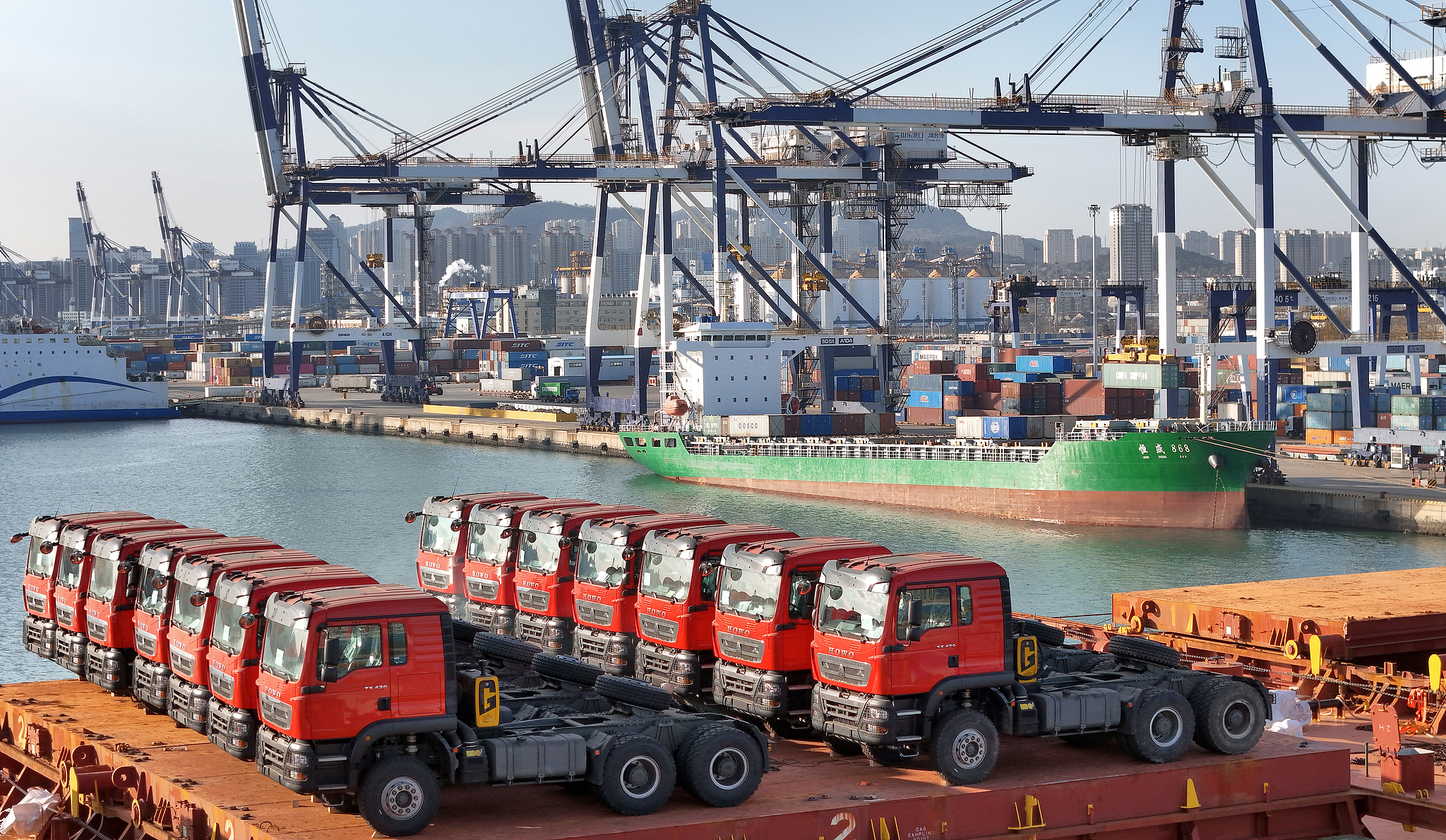 Heavy vehicles loaded for export at Yantai Port, China's Shandong Province, December 8, 2025. /VCG