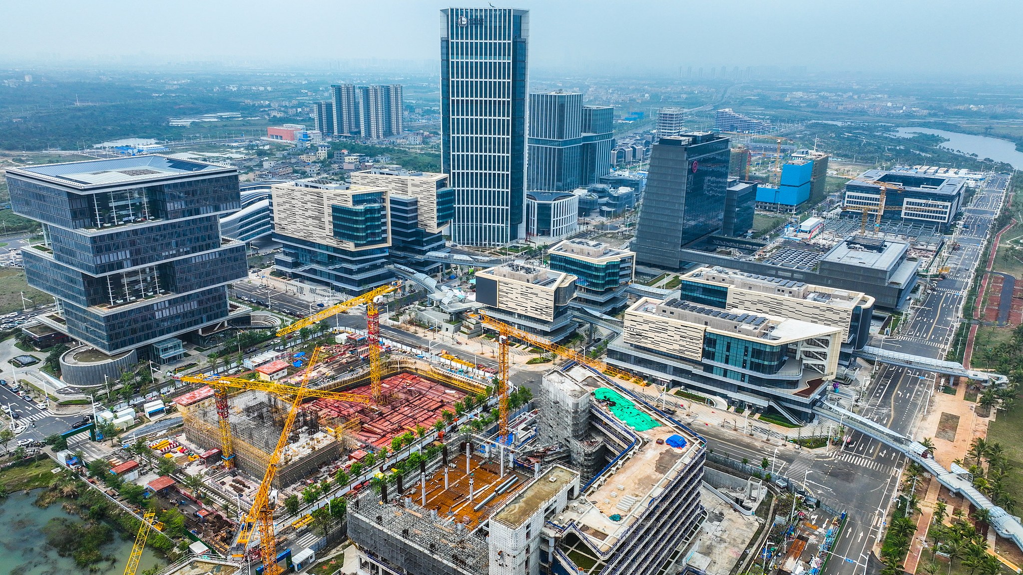 An aerial view of the construction of Haikou Jiangdong New Area industrial park, in China's Hainan Province, on December 5, 2025. /VCG