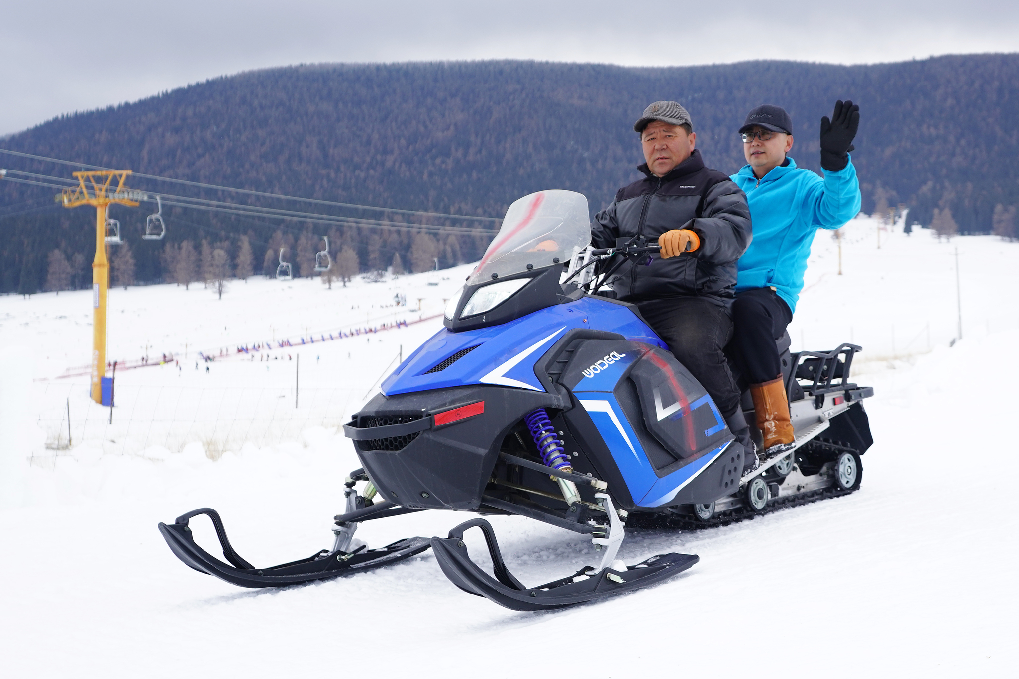 Visitors ride on a snowmobile at the Songshutang Ski Resort in Hami, northwest China's Xinjiang Uygur Autonomous Region, on December 6, 2025. /VCG
