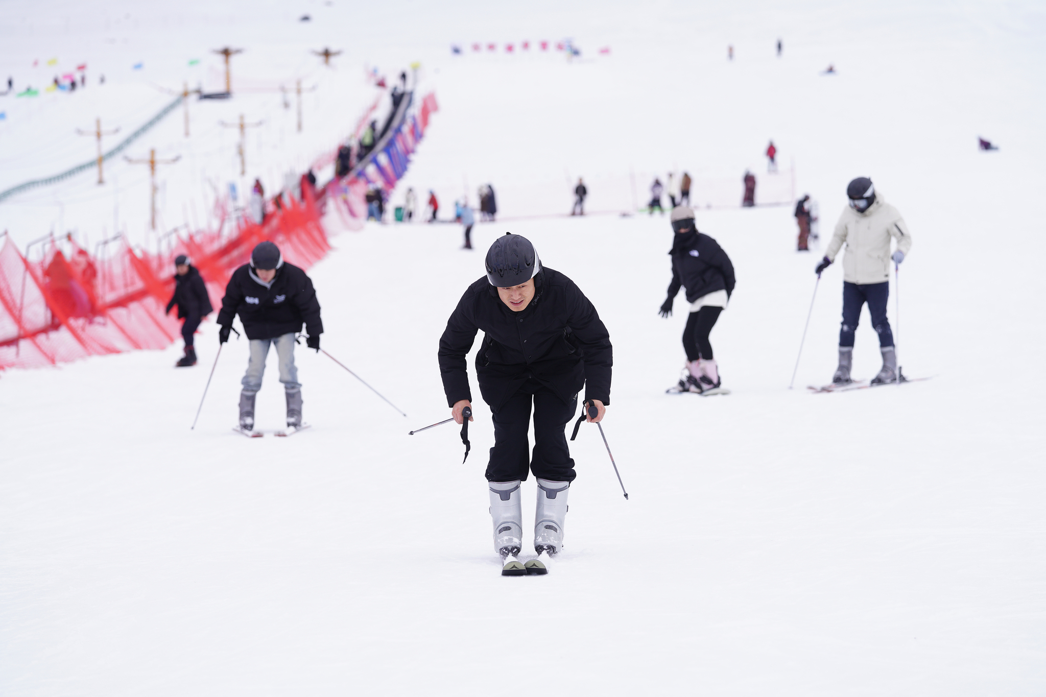 Visitors enjoy skiing at the Songshutang Ski Resort in Hami, northwest China's Xinjiang Uygur Autonomous Region, on December 6, 2025. /VCG