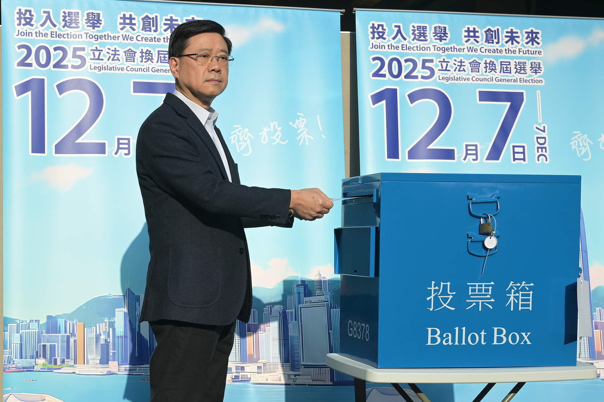 Hong Kong Special Administrative Region (HKSAR) Chief Executive John Lee casts his ballot at a polling station in Hong Kong, China, December 7, 2025. / CFP