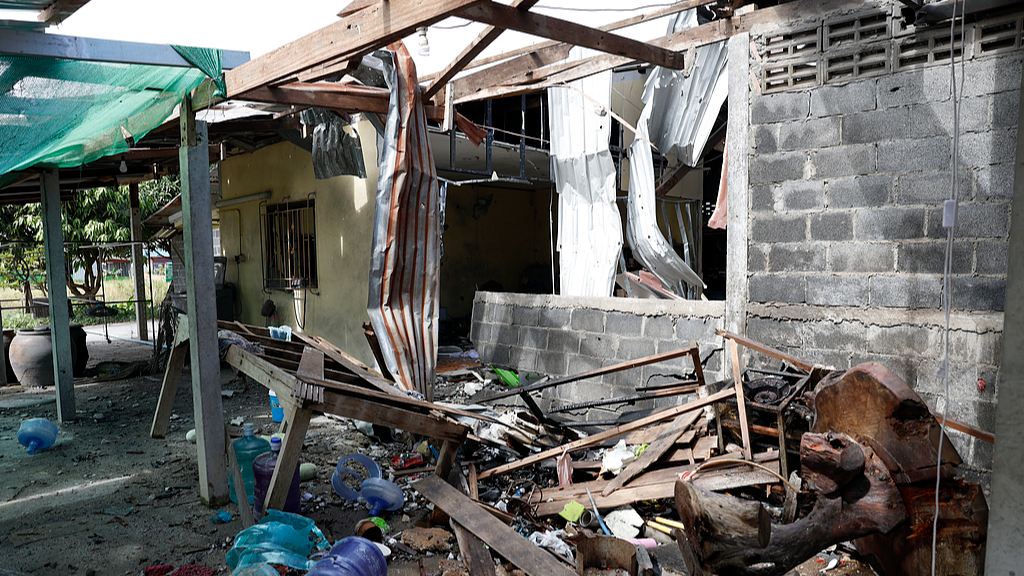 A view of a damaged house after hit by rockets during clashes between Thai and Cambodian troops at a village in Phanom Dong Rak, Surin province, Thailand, December 11, 2025. /VCG
