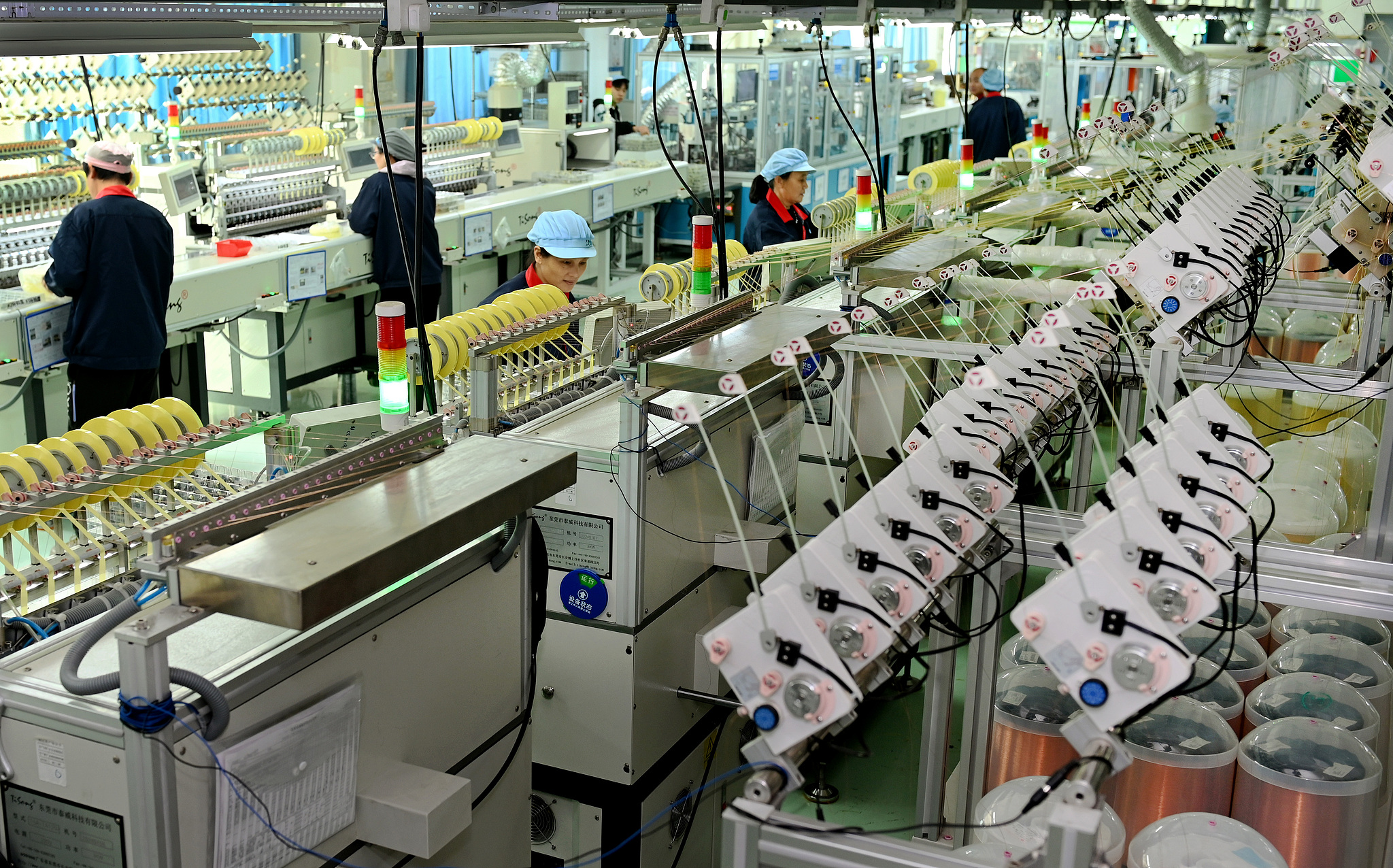 Workers make products for export orders at an electronics manufacturing company in Shaoyang, central China's Hunan Province, November 25, 2025. /VCG