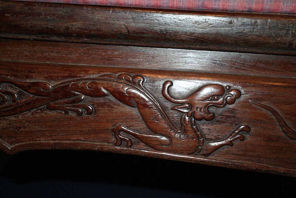 Carvings in furniture often symbolized spiritual beliefs or social status. /VCF