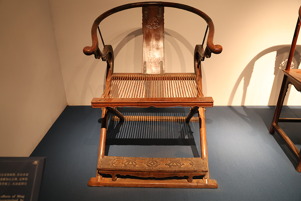 The folding chair is known for it's crossed legs and portability. /VCG