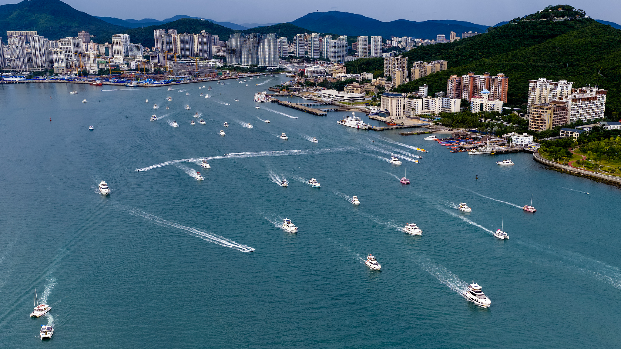Locals and visitors race across the water on yachts and speedboats in Sanya Bay, Hainan Province, China, August 16, 2025. /CFP