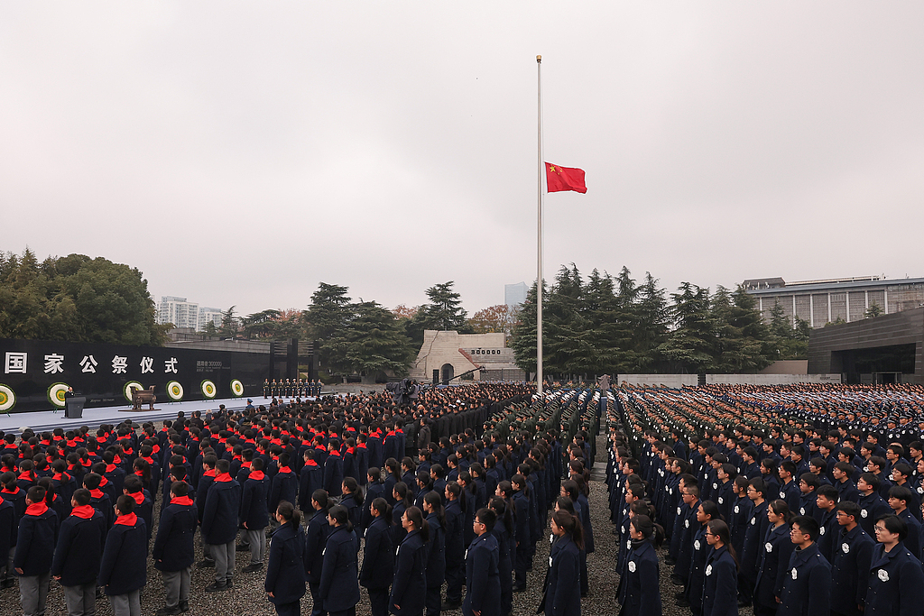 A flag-raising ceremony and a ceremony to lower China's national flag to half-mast are held at the Memorial Hall of the Victims in Nanjing Massacre by Japanese Invaders in Nanjing, capital of east China's Jiangsu Province, December 13, 2025. /VCG