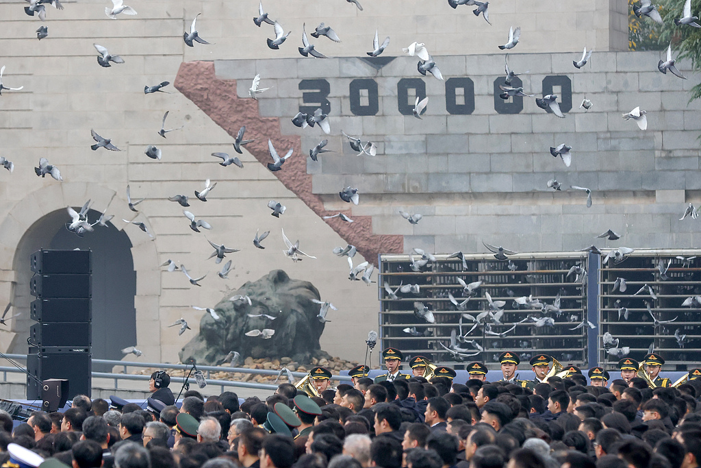 A flag-raising ceremony and a ceremony to lower China's national flag to half-mast are held at the Memorial Hall of the Victims in Nanjing Massacre by Japanese Invaders in Nanjing, capital of east China's Jiangsu Province, December 13, 2025. /VCG