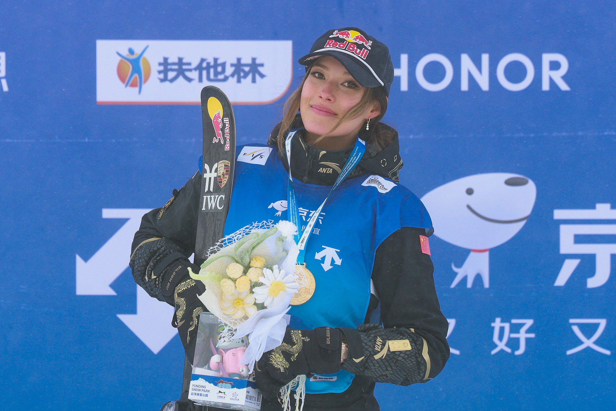 China's Gu Ailing celebrates during the awards ceremony after winning the women's halfpipe final at the FIS Freeski World Cup at Genting Snow Park's Secret Garden Resort in Zhangjiakou, China, December 13, 2025. /VCG