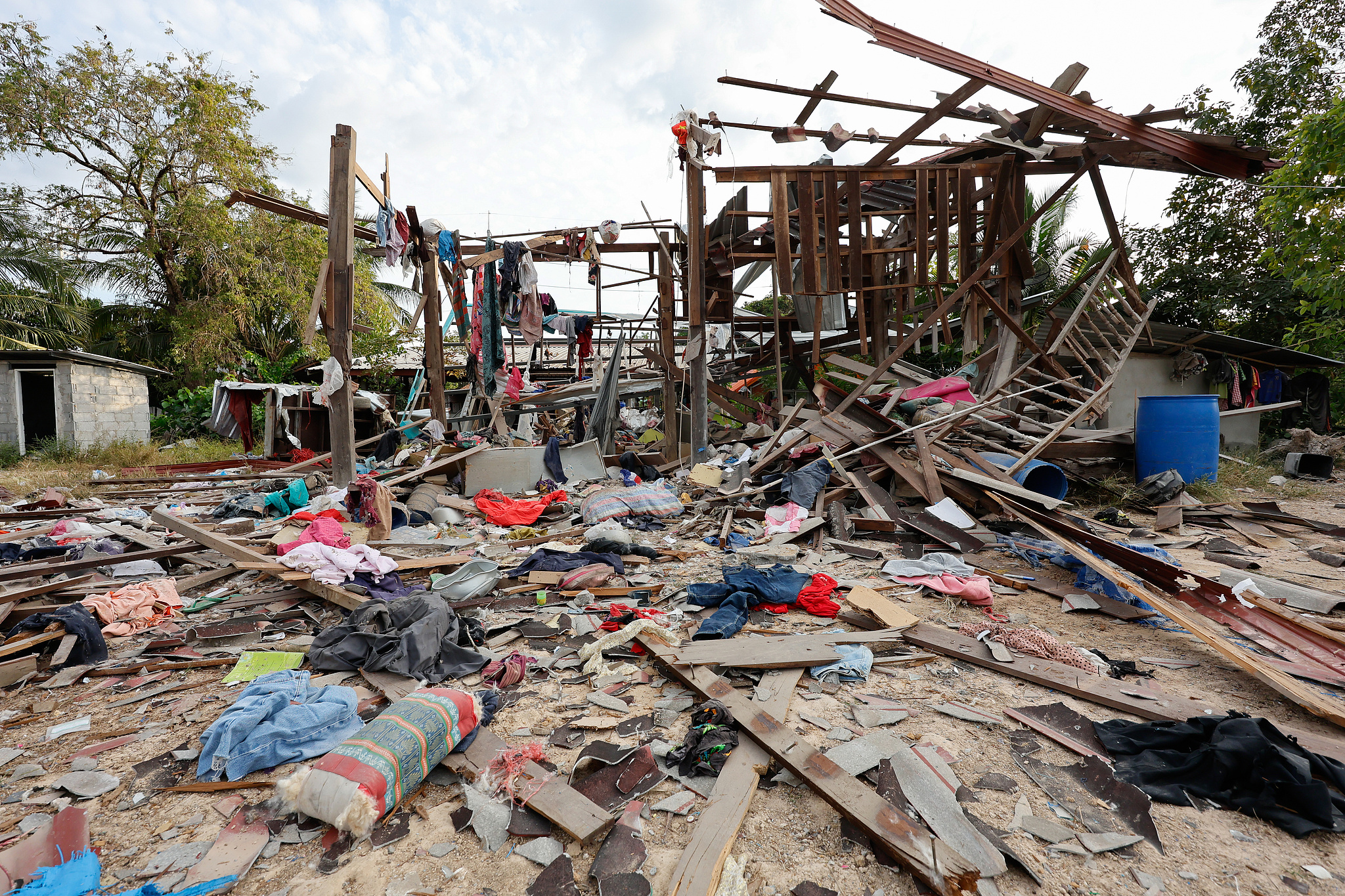 Thai civilian homes sustained heavy damage from explosions caused by Cambodian forces' BM-21 rocket artillery, Kantharalak District, Sisaket Province, December 14, 2025. /VCG