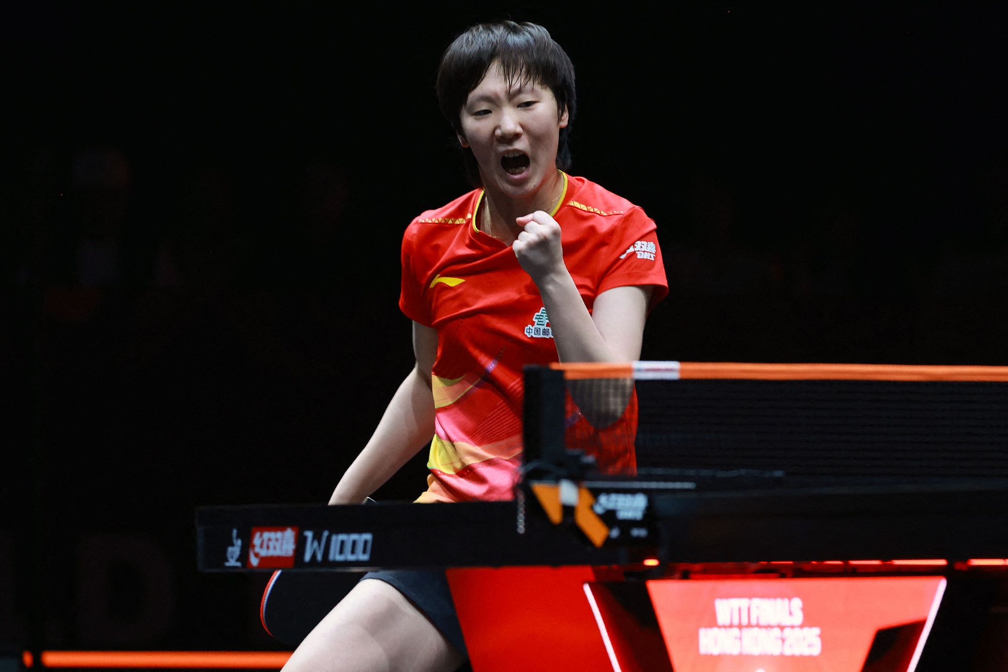 China's Wang Manyu reacts after taking a point against China's Kuai Man in the women's singles final at the WTT (World Table Tennis) Finals at the Hong Kong Coliseum in Hong Kong SAR (Special Administrative Region), China, December 14, 2025. /VCG