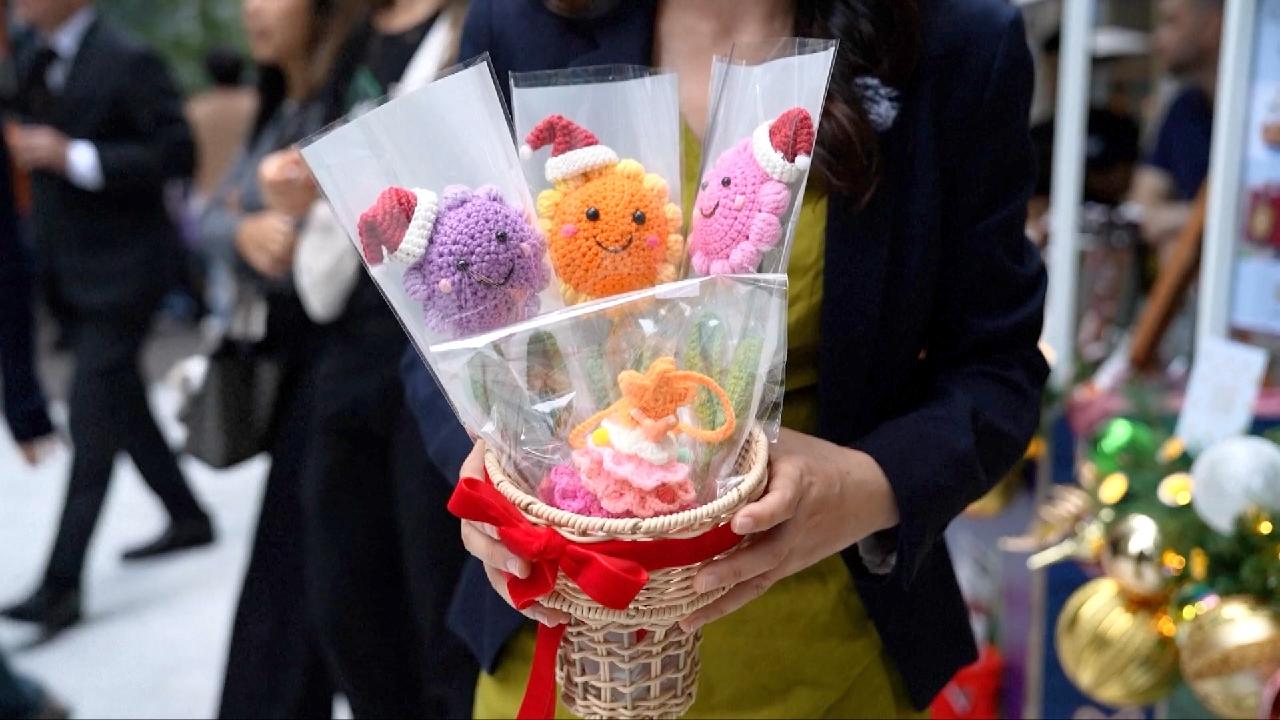 Holiday fair in Hong Kong raises funds for victims of deadly fire