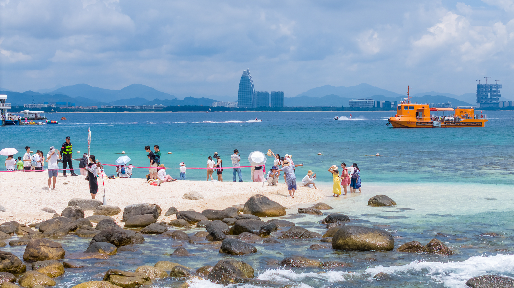 Tourists at the pristine seaside in Hainan Province in south China, August 9, 2025. /CFP
