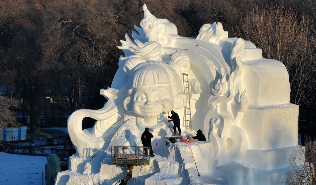 A sculpture of Ne Zha is under construction at the Harbin Sun Island International Snow Sculpture Art Expo in Heilongjiang, China, on December 13, 2025. /CFP