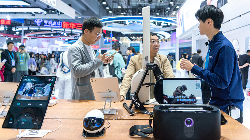 A Chinese tech company showcases devices at the 2025 Digital Intelligence Technology Ecosystem Conference, Guangzhou, Guangdong Province, China, December 5, 2025. /VCG