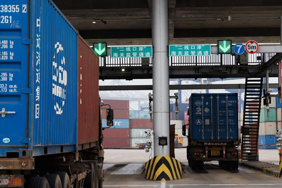 Trucks go through stress test rehearsals at Yangpu International Container Terminal in Danzhou, south China's Hainan Province, December 11, 2025. /Xinhua